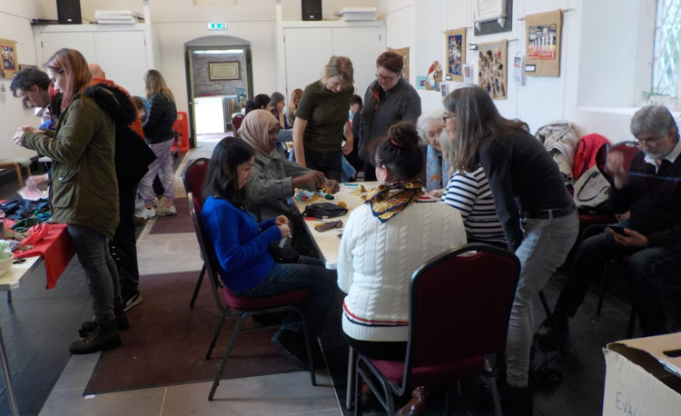Participants engaged in the inter-generational Conflict Textiles workshop as part of the Cushendun Big Arts Weekend. (Photo: Clem McCartney)