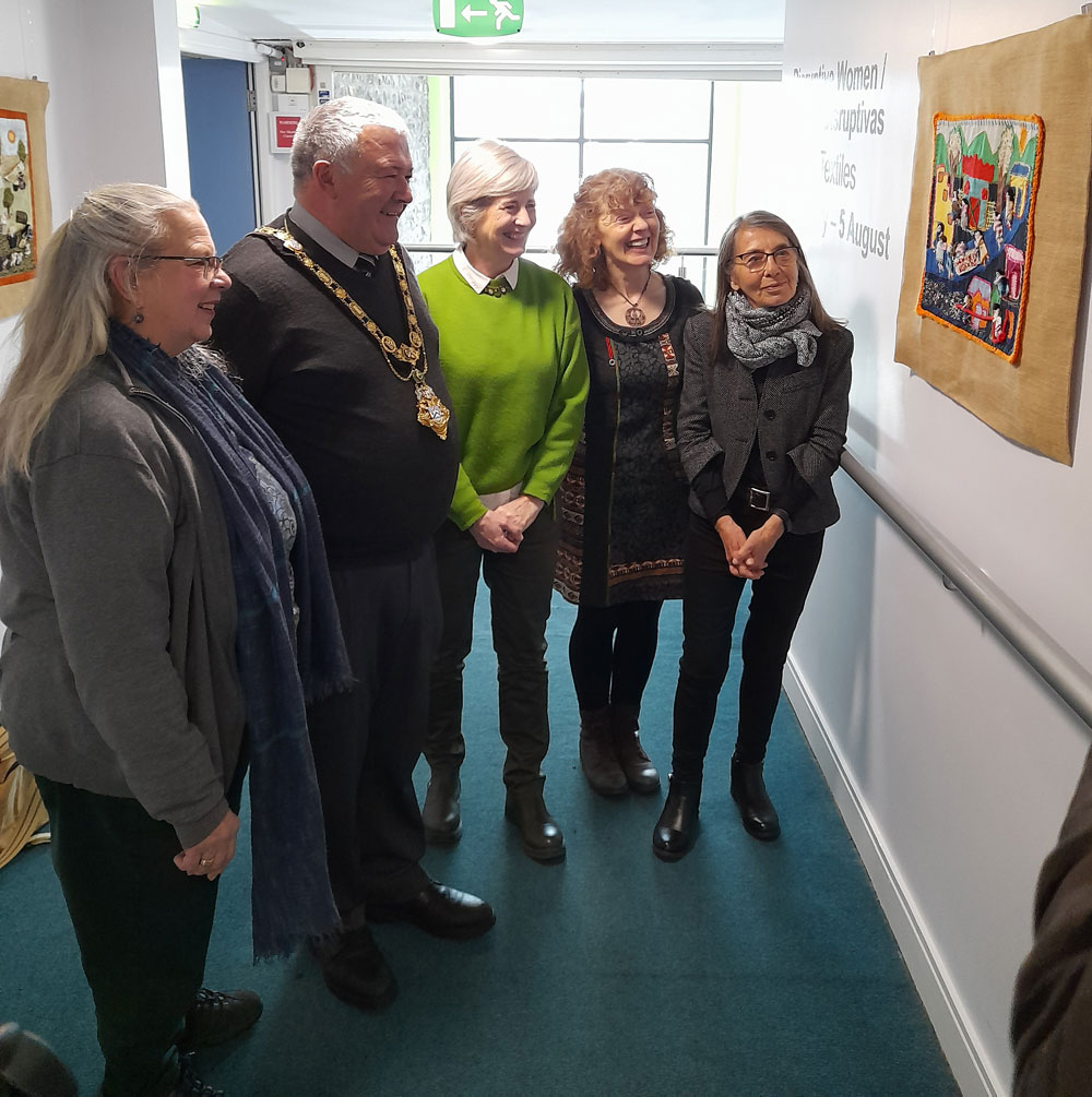 The Conflict Textiles team  with Councillor Ivor Wallace, Mayor of Causeway Coast and Glens at the launch of the 'Mujeres Disruptivas' exhibition in Flowerfield Arts Centre, 8 February, 2023. (Photo: Conflict Textiles)