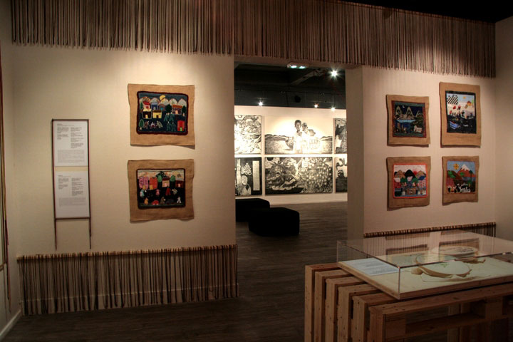 Arpilleras from the Conflict Textiles collection on exhibit at the Rebelles exhibiton, as part of the FITE 2016 - International Festival of Extraordinary Textiles (FITE). (Photo: Exposition Rebelles, musée Bargoin ©R. Boissau, Ville de Clermont-Ferrand)