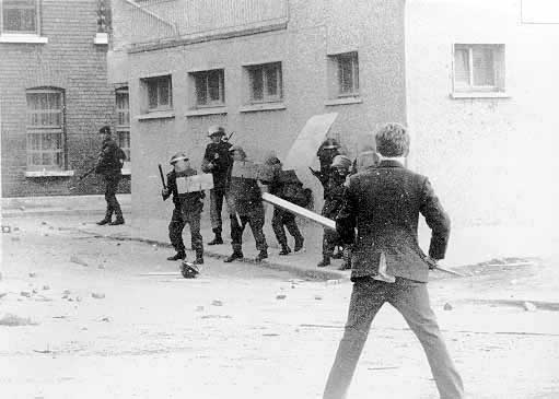A local youth confronts soldiers in riot gear, Abbey Street, June 1971