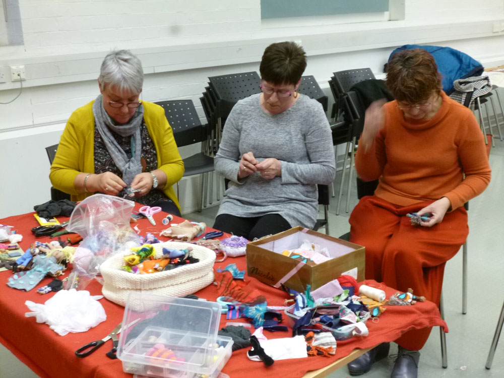 Women engrossed in their task of making an arpillera doll at the workshop in the Ulster Museum, Belfast, 1st December, 2017. (Photo: Karen Logan)
