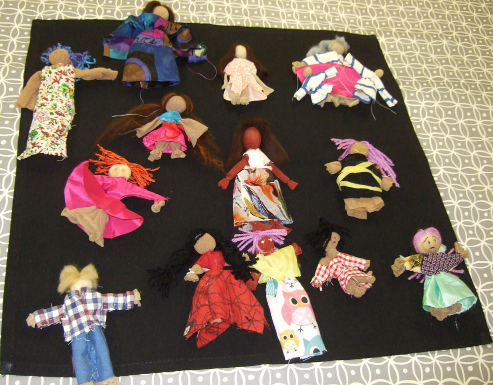 Arpillera dolls made by participants in the Conflict Textiles workshop. Each doll relates to one of the arpilleras on display as part of the Symposium event. (Photo: Joanne Quigley)
