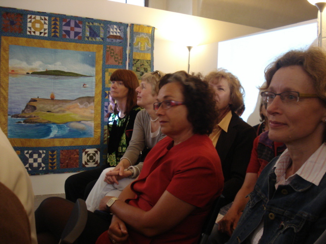 Participants at the exhibition launch listening to speakers' inputs. (Photo: Women in One World)