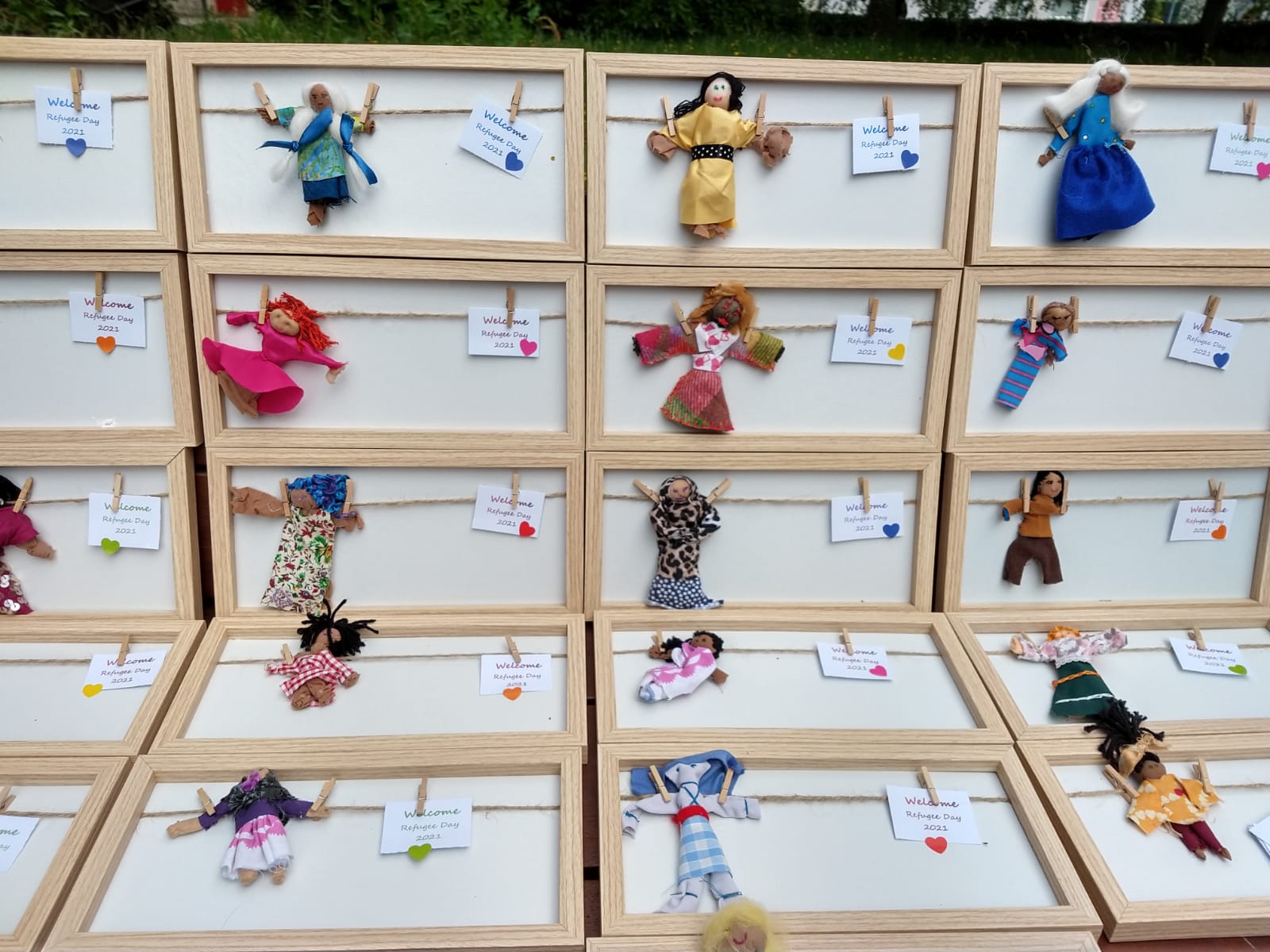 Some of the dolls completed at the Amnesty / Conflict Textiles Refugee Day 2021 outdoor workshop, as a welcome gift for the residents of Letterkenny Direct Provision Centre. (Photo: Anna Daly)