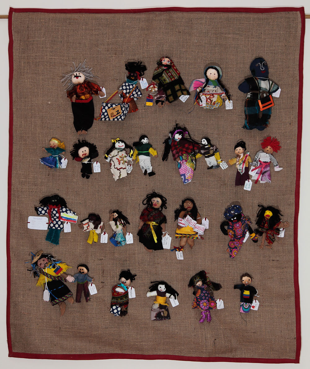 Outcome banner with the 26 dolls made by workshop participants. (Photo: Martin Melaugh © Conflict Textiles)