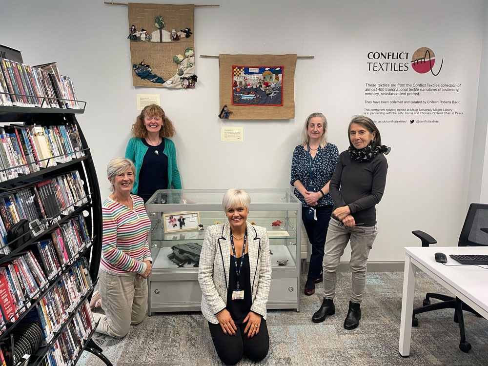 Conflict Textiles team and Ulster University colleagues pictured after installing the two arpilleras and objects connected to the film and exhibition 