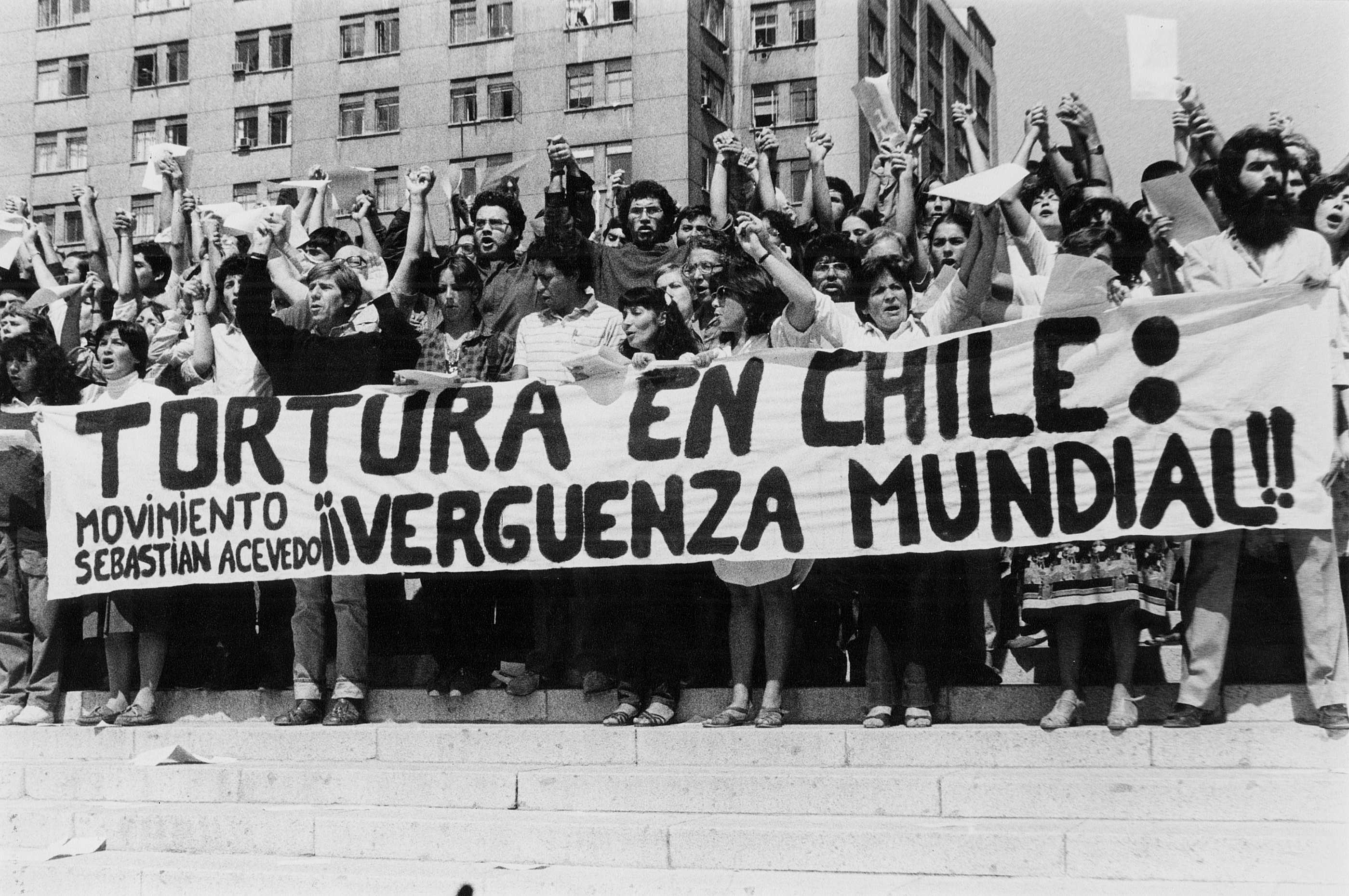 Demonstration against torture by the group 'Movement Against Torture Sebastián Acevedo', as depicted in the textile ‘En Chile se tortura / Demonstration against torture’. Violeta Morales is at the front, third from right, (Photo: © Conflict Textiles)