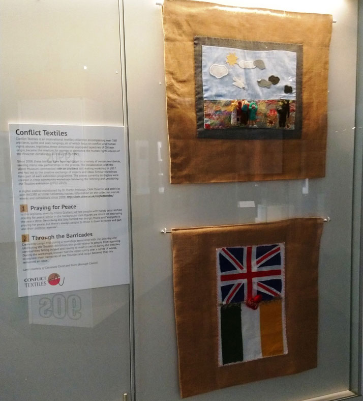 Arpilleras from Causeway Museum Service collection, 'Praying for Peace' and 'Through the Barricades', on display within “The Troubles and Beyond” exhibition. (Photo: Karen Logan)