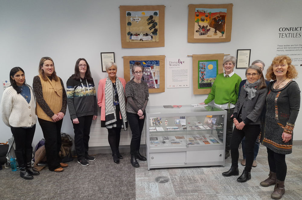 The Conflict Textiles team and colleagues from Ulster University, the Tower Museum, The Void Gallery and Ulster Museum at the opening of the 'Mujeres Disruptivas' exhibition trail in Magee Campus Library, 8 February, 2023. (Photo: Breege Doherty)