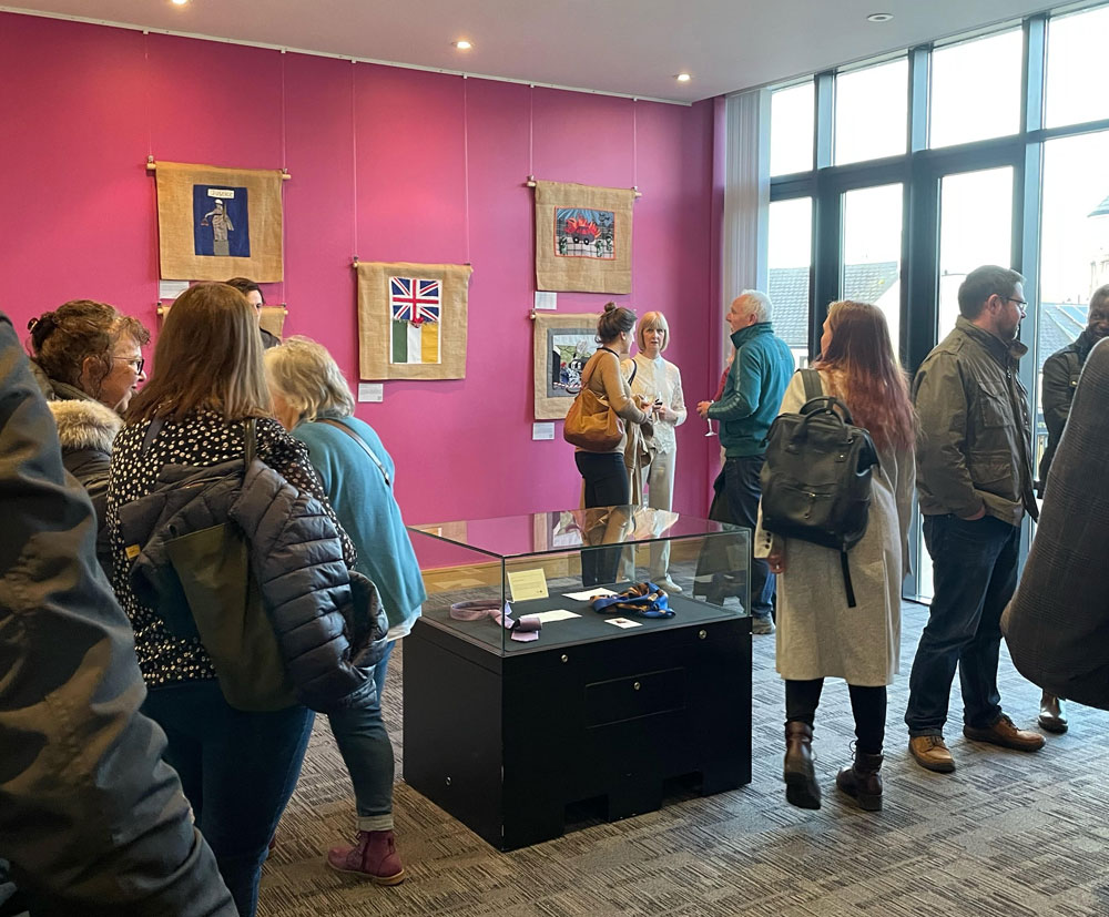 Attendees viewing the exhibition 