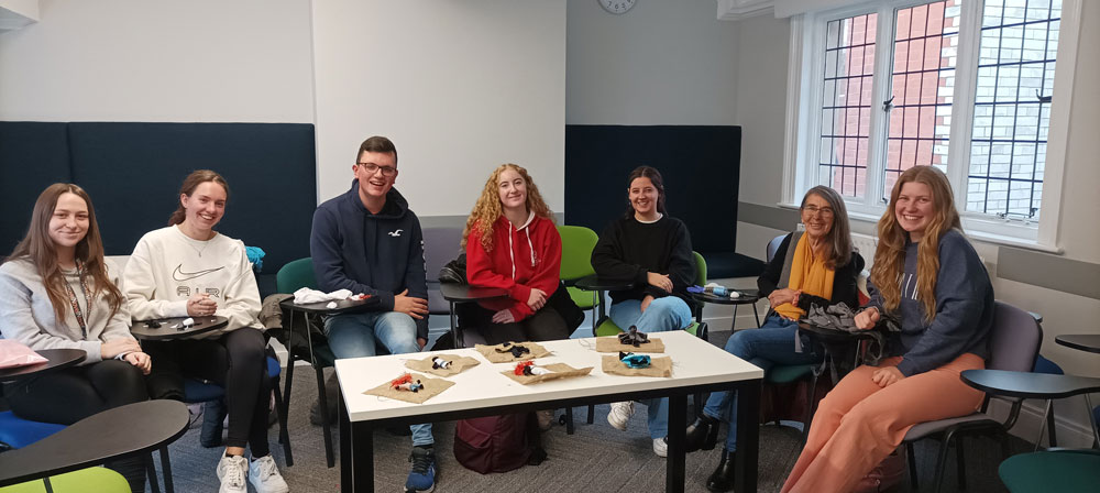 Students from the Schools of Arts, English and Languages, Queen's University Belfast during their 'hands on' arpillera workshop with Conflict Textiles curator, Roberta Bacic - second from right. (Photo: Fiona Clark)